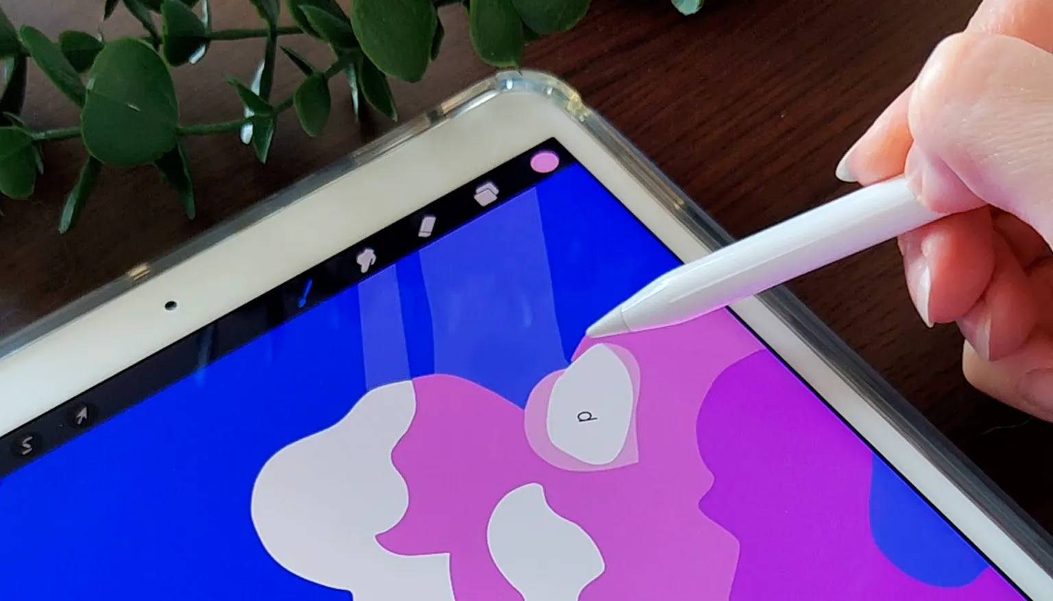 Coloring a paint-by-number page on an iPad with a stylus