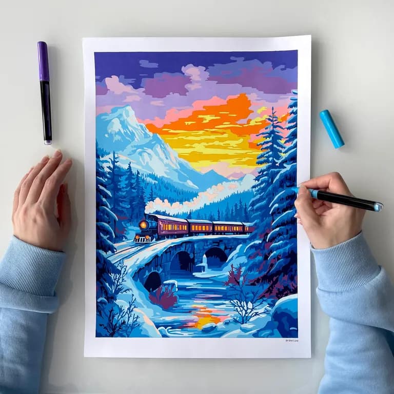 Coloring a winter scene of a train crossing a snowy stone bridge at sunset with markers